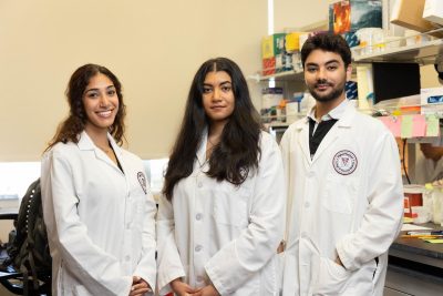 Photo of Aida Shakeri, Rana Estaleen, and Pavly Amin of the Xin Luo Lab at the Virginia Maryland College of Veterinary Medicine.