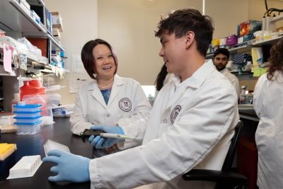 Photo of Noah Oakland and Dr. Xin Luo, PhD, of the Xin Luo Lab at the Virginia Maryland College of Veterinary Medicine.