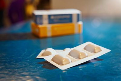 Pack of heartworm medication on an exam table. 