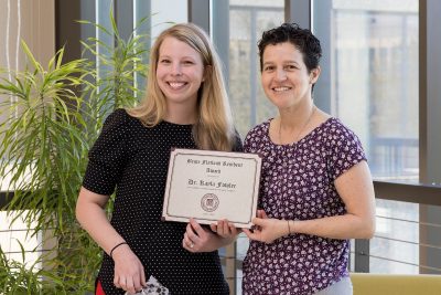 Kayla Fowler and Natalia Henao-Guerrero posing with the Bente Flatland Resident Award.