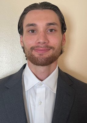 Headshot of Alex Wheatley.