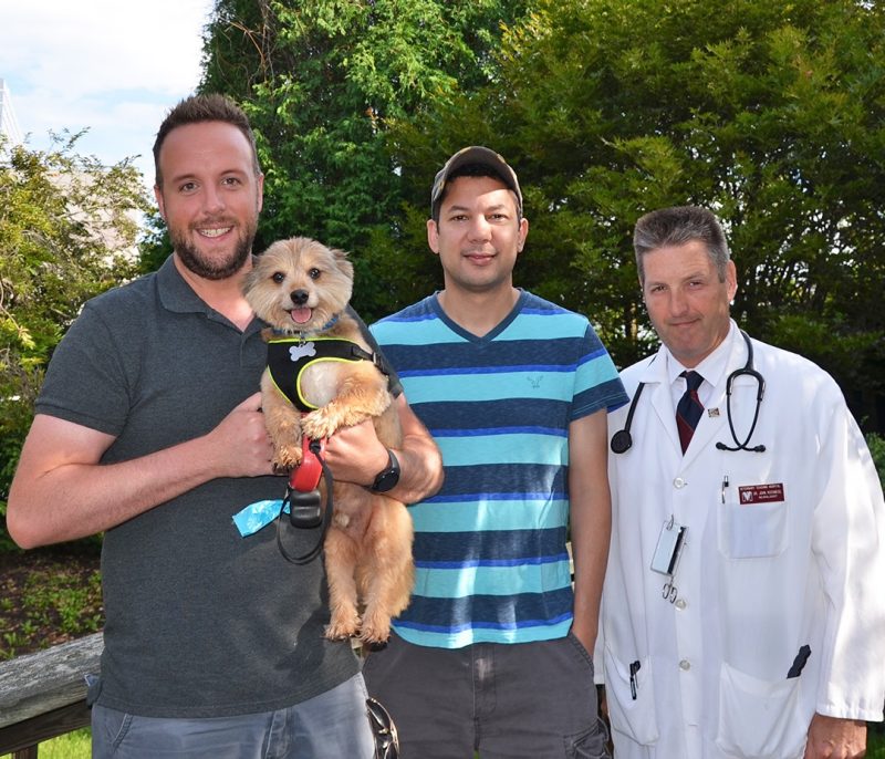 Charlie with his owners and Prof. Rossmeisl. Four months after his treatment, Charlie’s recheck MRI showed no evidence of tumor.